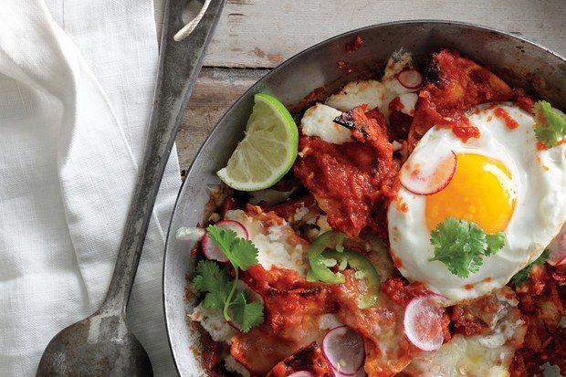 Spicy chilaquiles with eggs and vegetables - Mexican recipe